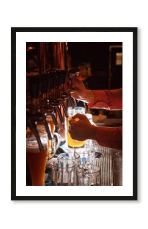 Filling of light beer from a tap in the bar