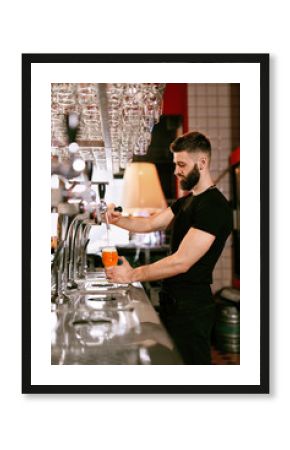 Bartender Working At Bar Pub Pouring Beer In Glass