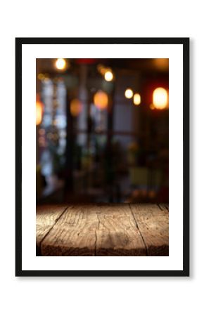 blurred background of bar and dark brown desk space of retro wood