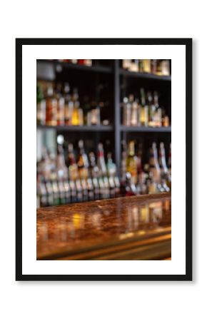 Bar counter with blurred image of bottles. Shallow depth of field.
