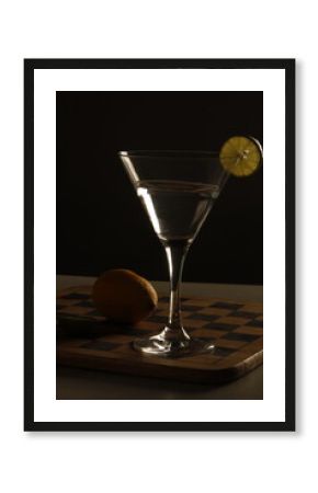 Silhouette of a cocktail glass with lemon slice. Minimal lighting and high contrast, ideal for modern drink ads, bar menus, and branding visuals.