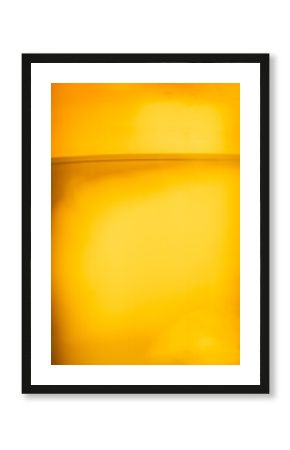 Golden beer close-up with bubbles in glass