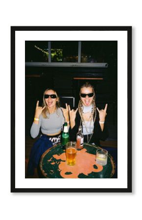 Two friends having fun at a lively bar