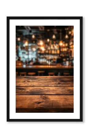 Empty wooden table in front of blurred bar with warm lights and stools creating a cozy ambiance