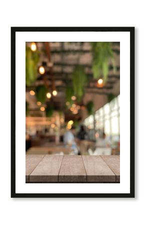 Empty wooden table top with lights bokeh on blur restaurant background.