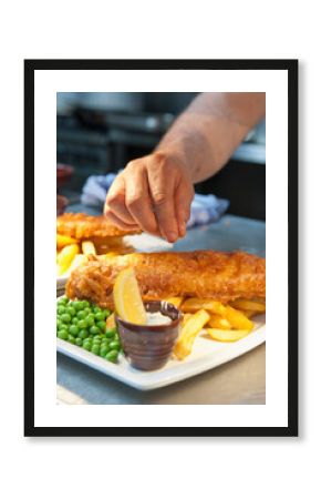 fish and chips prepared at commercial kitchen in the UK