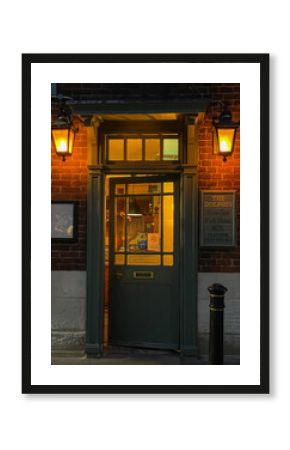 Twilight ambiance at a cosy English pub entrance illuminated by warm lanterns