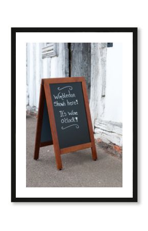 Wimbledon shown here pub sign on a vertical blackboard