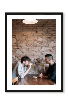 Men drinking beer in pub