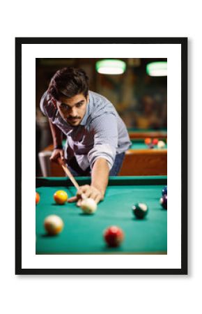 billiard game- young man playing snooker.