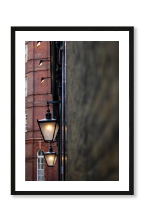 Victorian lanterns on a pub wall in central London.