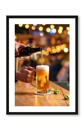 Bartender pouring beer into a glass