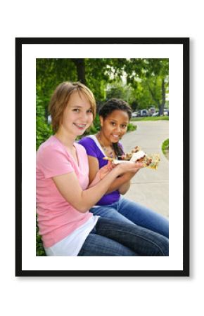 Girls eating pizza