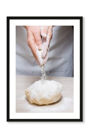 Hands kneading a dough