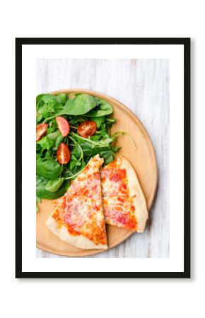 Slices of pizza with side salad
