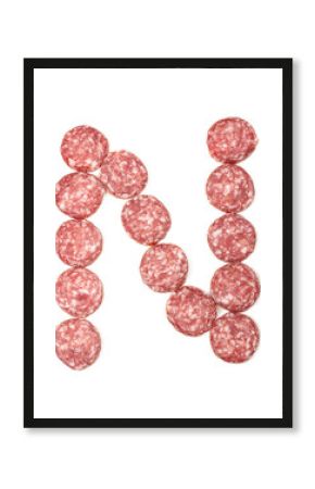 Alphabet letter N arranged from salami sausage slices