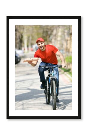 Young man with bike delivering pizza