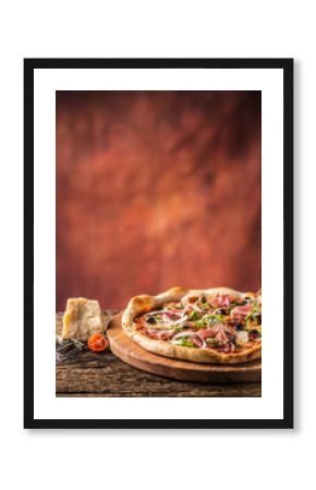 Italian pizza with prosciutto tomatoes olives olive oil parmesan cheese and arugula.