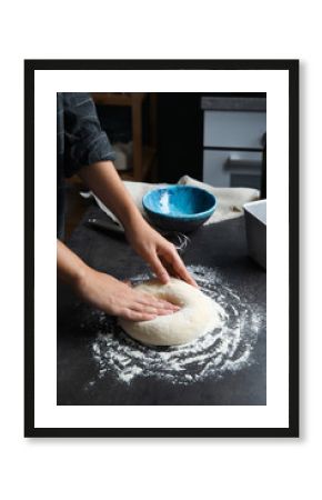 Woman kneading dough for pastry on table