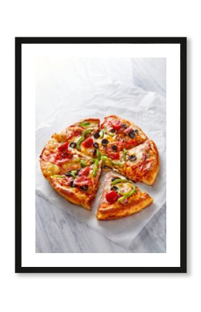 Italian pizza viewed from above on a light marble background. Top view