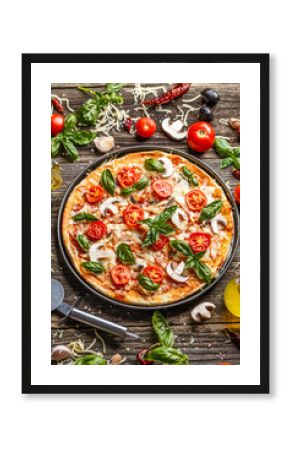 Pizza decorated with basil leaves