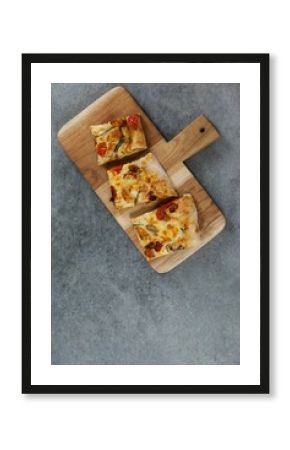 Pizza slices on wooden tray