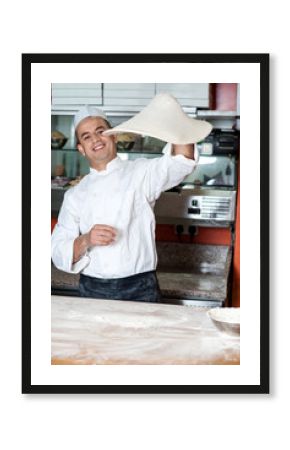 Chef throwing the pizza base dough