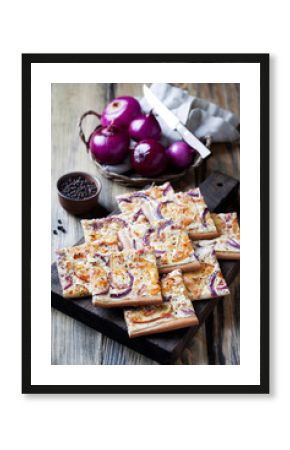 Tart flambee with purple onions, bacon and apples (Flammkuchen), selective focus