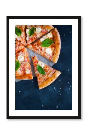 Homemade Pizza with tomato sauce,  olives,  fresh mozzarella, parmesan and basil on the dark background
