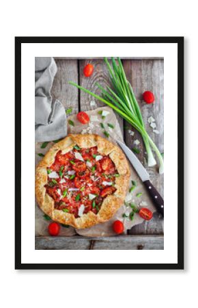 Delicious homemade rustic open pie (galette) with tomato, cheese and onion