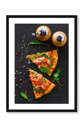 Pizza with prosciutto and rocket salad copy space