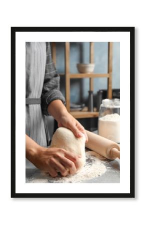 Woman kneading dough for pastry on table