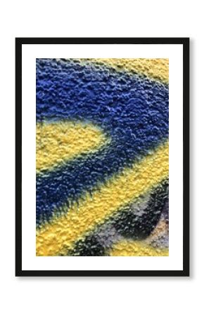 Blue and yellow street-art paint graffiti close-up rough texture wallpaper background