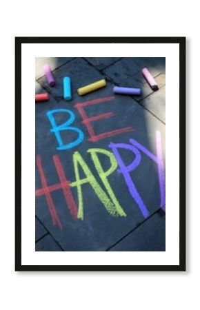 Sidewalk with Pastel Chalk Message Saying Be Happy on a Bright Day