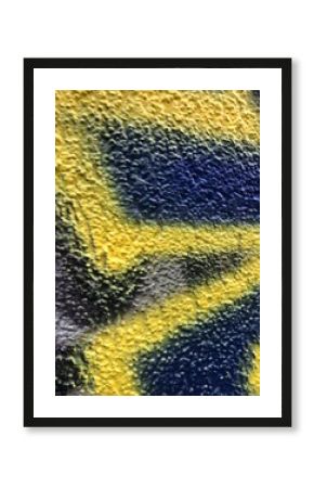 Blue and yellow street-art paint graffiti close-up rough texture wallpaper background