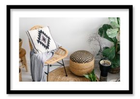 boho style in apartment with houseplants and wicker furniture