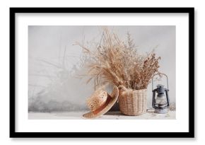 still life country with lantern and wicker basket. boho chic style decorations