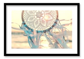 Dream catcher against sunrise. Handmade work is ethnic symbol