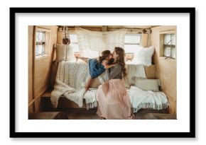 Mother and daughter kissing in boho studio setup