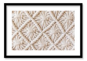 Close-up of hand made macrame texture pattern. ECO friendly modern knitting DIY natural decoration concept. Flat lay.