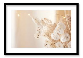Pampas grass and lunaria are collected in a bouquet for room decor. Bouquet of dried flowers. Floral minimal home interior boho style. Boho style holiday photo zone decor