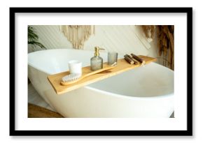 Stylish bathroom interior in boho style. The bathroom has a shelf for brushes, soap and body oils.