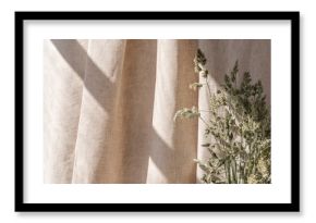 Aesthetic boho neutral floral background, abstract sunlight shadows on beige linen curtain and meadow grass, elegant business, interior or wedding design template