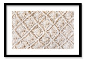 Close-up of hand made macrame texture pattern. ECO friendly modern knitting DIY natural decoration concept. Flat lay.
