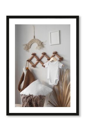 Minimalist white baby short sleeve bodysuit mockup for presentation cute sublimation designs. Minimalistic photos of romper for toddlers in scandinavian boho interior with minimalistic decoration