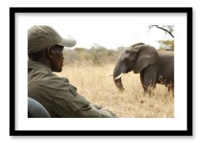 Safari adventure unfolds: A ranger observes a majestic elephant in its habitat