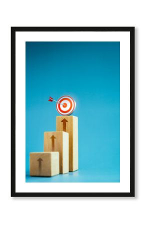 Target icon on top of wooden blocks with rise up arrows, 3d bar graph chart steps on blue background, vertical style, business growth process, profit, investment, economic improvement concepts.