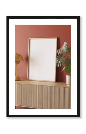 3d render of a modern mockup interior with wooden frame on a dark pale red wall, a sideboard and a pot with a monstera plant 