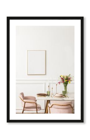 Blank canvas by a dining table in a modern boho chic aesthetic dining room