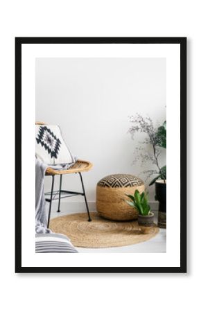 blanket and pillow on chair in room with bohemian design